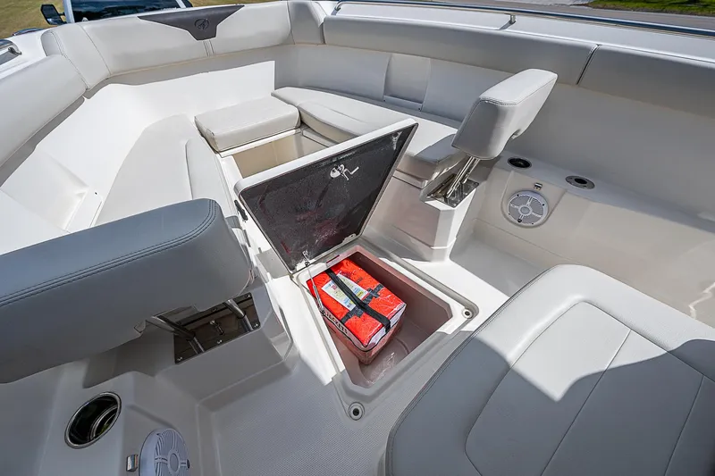 Slide: The Image of 2022 Sailfish 272CC boat interior with open storage compartment and seating. - 29