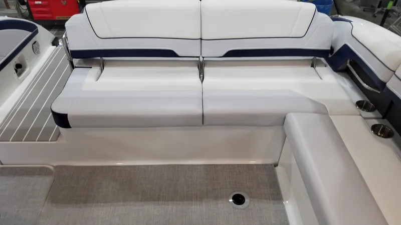 Slide: The Image of 2025 Formula 330 Crossover Bowrider I/O interior seating with sleek white and navy design. - 10
