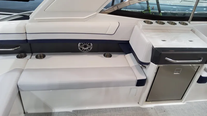 Slide: The Image of 2025 Formula 330 Crossover Bowrider I/O interior seating and kitchenette area. - 14