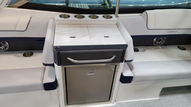 Slide: The Image of 2025 Formula 330 Crossover Bowrider I/O interior with seating and storage. - 18