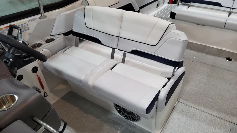 Slide: The Image of 2025 Formula 330 Crossover Bowrider I/O interior with white seating and modern design. - 22