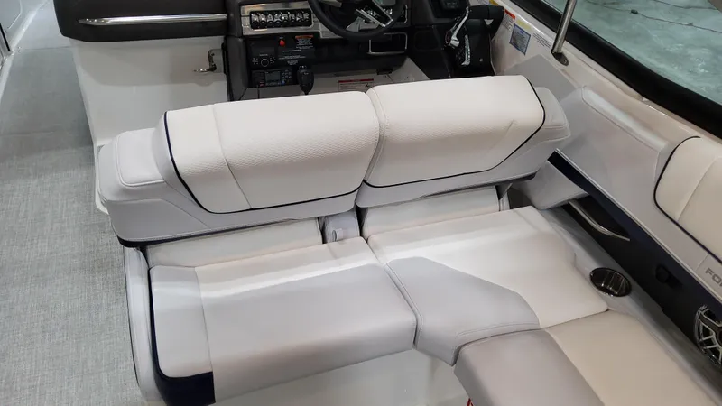 Slide: The Image of 2025 Formula 330 Crossover Bowrider I/O interior with white seating and modern dashboard. - 23