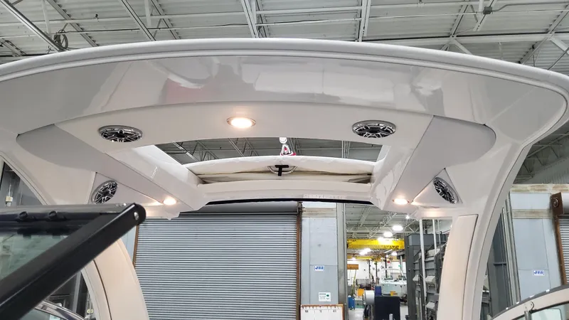 Slide: The Image of 2025 Formula 330 Crossover Bowrider I/O boat interior with sleek design and modern lighting. - 25