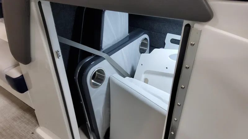 Slide: The Image of Storage compartment in 2025 Formula 330 Crossover Bowrider I/O boat with cup holders. - 29