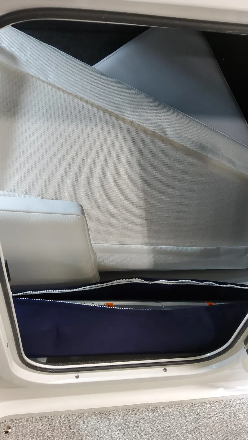 Slide: The Image of 2025 Formula 330 Crossover Bowrider I/O cabin interior with storage compartment. - 31