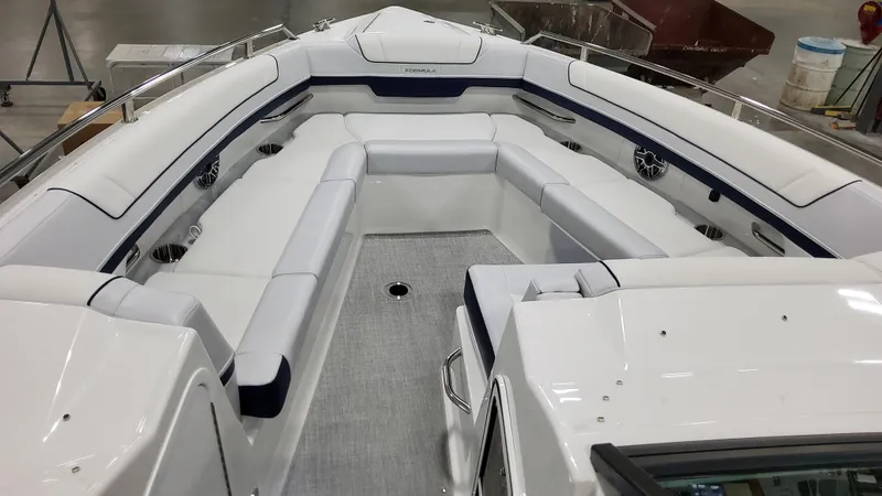 Slide: The Image of 2025 Formula 330 Crossover Bowrider I/O with spacious seating and sleek design. - 32