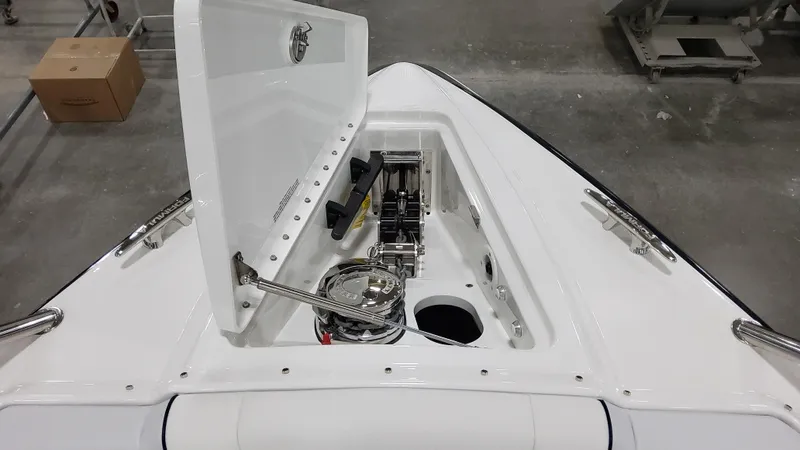 Slide: The Image of 2025 Formula 330 Crossover Bowrider I/O anchor storage compartment open, showcasing interior details. - 33