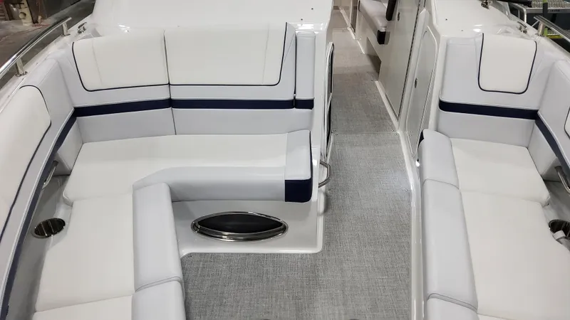 Slide: The Image of 2025 Formula 330 Crossover Bowrider I/O interior with sleek white seating and modern design. - 34