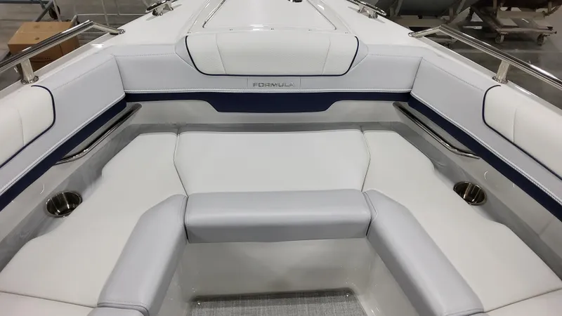 Slide: The Image of 2025 Formula 330 Crossover Bowrider I/O, luxurious white seating area. - 36