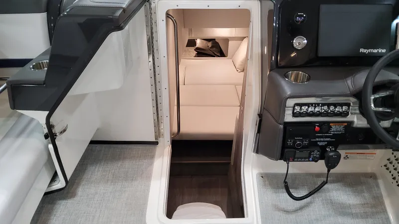 Slide: The Image of 2025 Formula 330 Crossover Bowrider I/O interior cabin with modern controls and seating. - 41