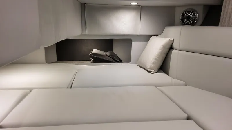 Slide: The Image of 2025 Formula 330 Crossover Bowrider I/O cabin interior with plush seating and modern design. - 44