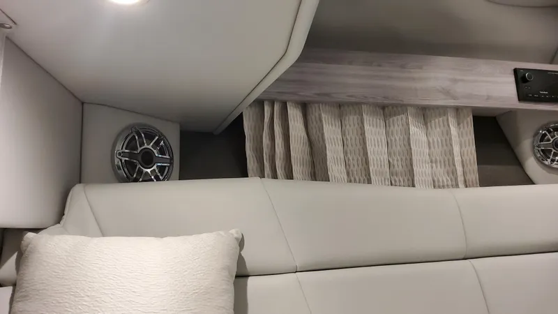 Slide: The Image of Interior of 2025 Formula 330 Crossover Bowrider I/O with modern upholstery and speaker. - 45