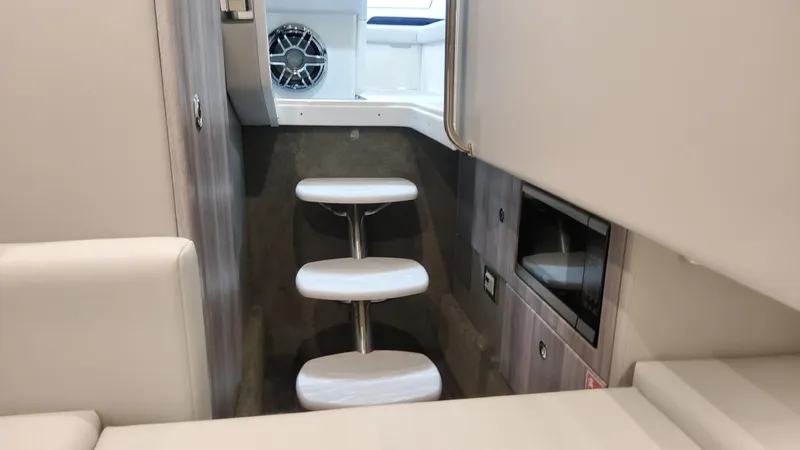 Slide: The Image of Interior of 2025 Formula 330 Crossover Bowrider I/O, featuring sleek stairs and modern design. - 47