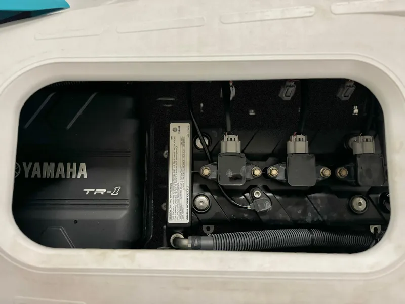 Slide: The Image of 2022 Yamaha WaveRunner EX engine compartment, showcasing TR-1 engine components. - 10