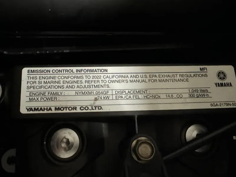 Slide: The Image of Emission control label on 2022 Yamaha WaveRunner EX engine, detailing specifications and compliance. - 12