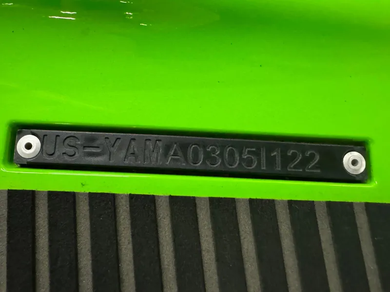Slide: The Image of Close-up of 2022 Yamaha WaveRunner EX serial number on green body. - 13