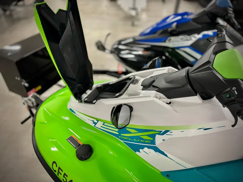 Slide: The Image of 2022 Yamaha WaveRunner EX in green and white, with open storage compartment. - 6