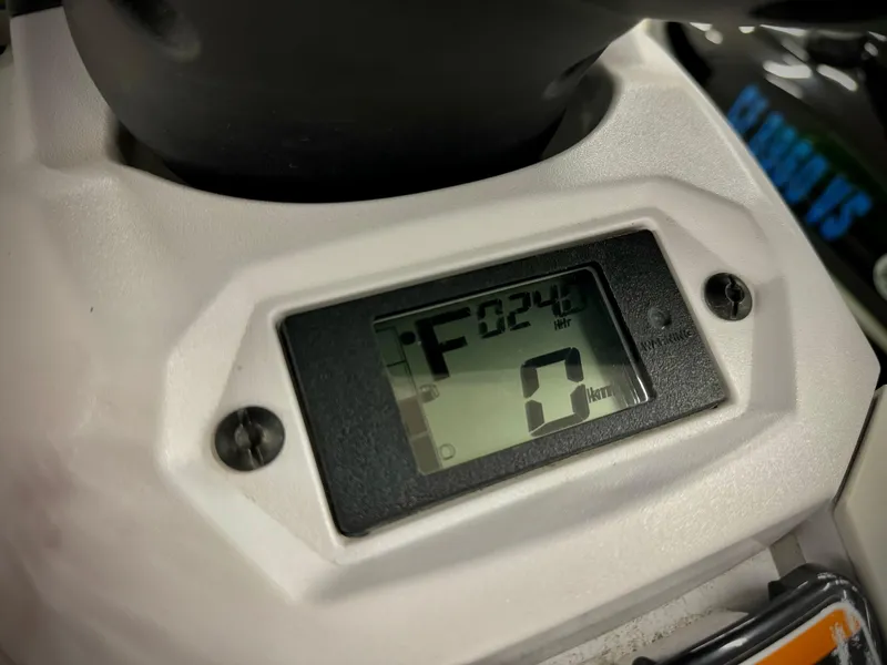 Slide: The Image of Close-up of 2022 Yamaha WaveRunner EX digital display showing 24.6 hours. - 8