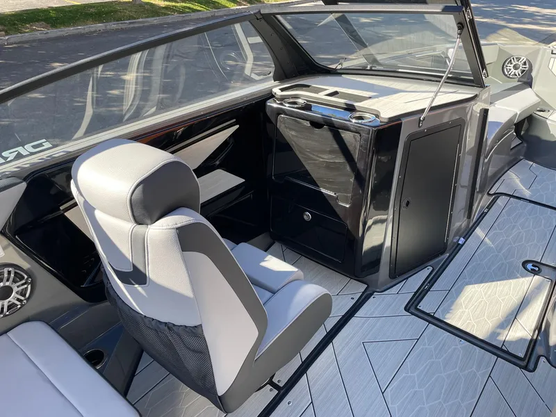 Slide: The Image of 2025 Yamaha Boats 222XD interior with sleek seating and modern dashboard design. - 10