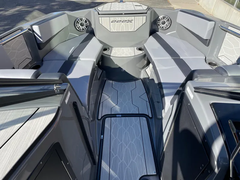 Slide: The Image of 2025 Yamaha Boats 222XD interior with sleek gray seating and modern design. - 11