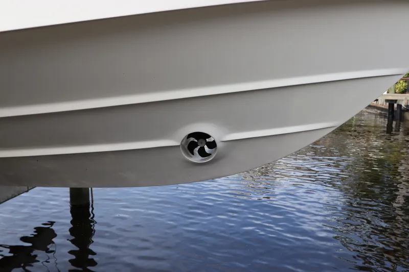 Slide: The Image of Close-up of 2019 Boston Whaler 315 Conquest hull with bow thruster in water. - 3