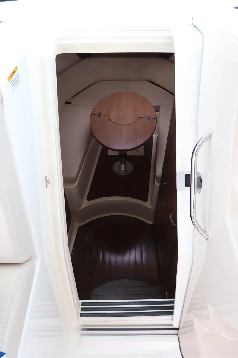 Slide: The Image of Interior cabin view of 2019 Boston Whaler 315 Conquest with wooden table. - 35