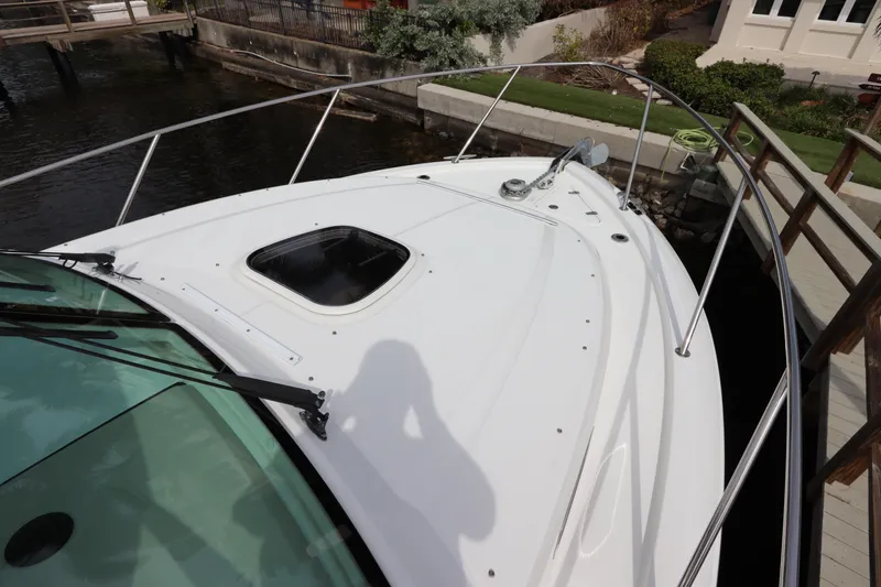 Slide: The Image of 2019 Boston Whaler 315 Conquest boat deck with railing and hatch. - 4
