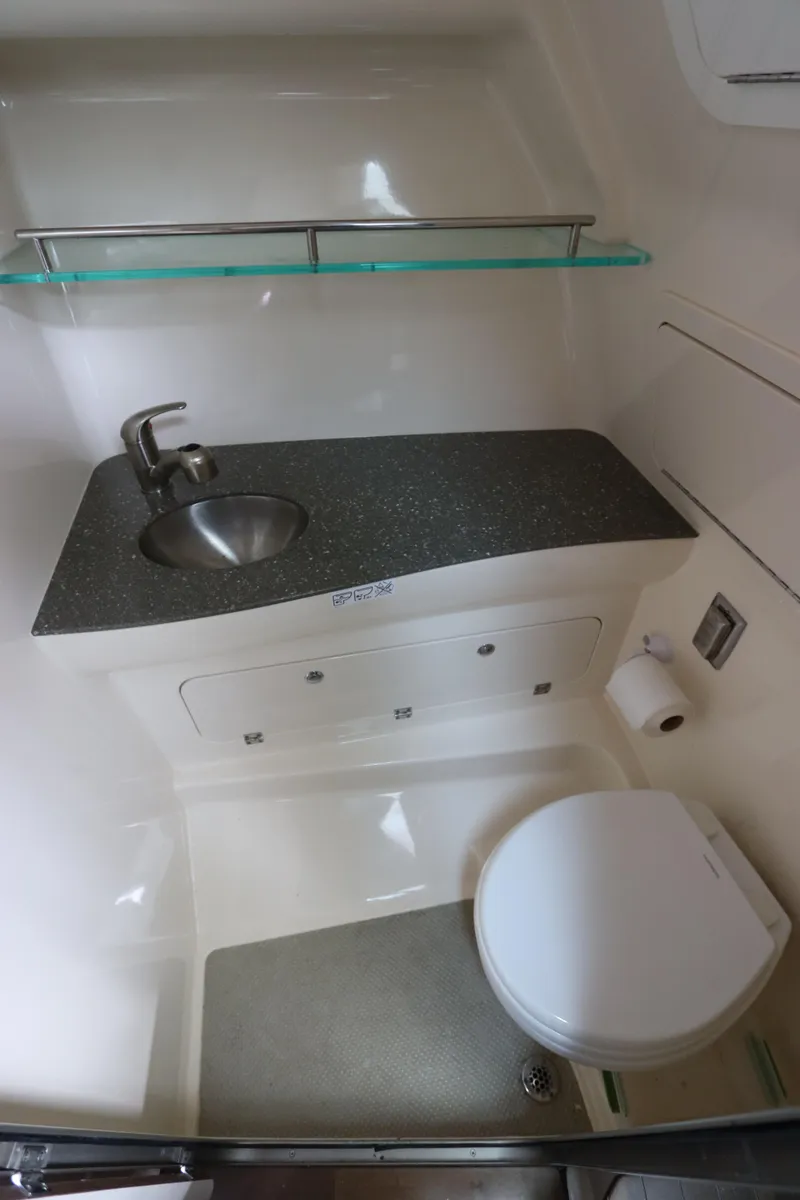 Slide: The Image of 2019 Boston Whaler 315 Conquest bathroom with sink, toilet, and storage. - 40