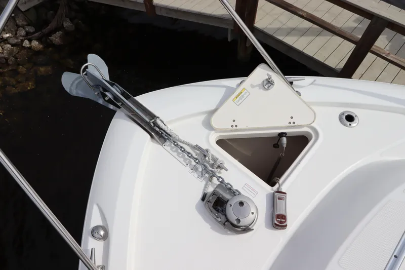 Slide: The Image of 2019 Boston Whaler 315 Conquest anchor system on deck, featuring storage compartment. - 5