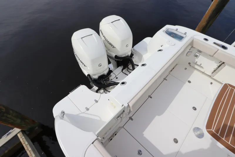 Slide: The Image of 2019 Boston Whaler 315 Conquest boat with dual Mercury outboard engines. - 9