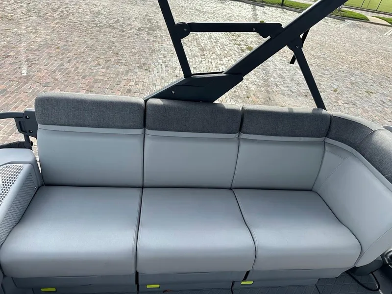 Slide: The Image of 2023 Sea-Doo Switch Cruise 21 seating area with gray cushioned seats. - 14