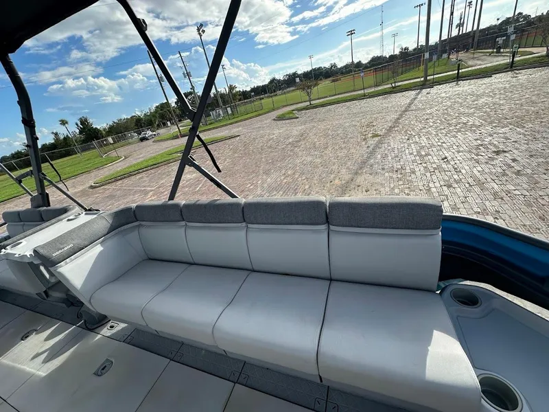 Slide: The Image of 2023 Sea-Doo Switch Cruise 21 interior with spacious seating and scenic outdoor view. - 16