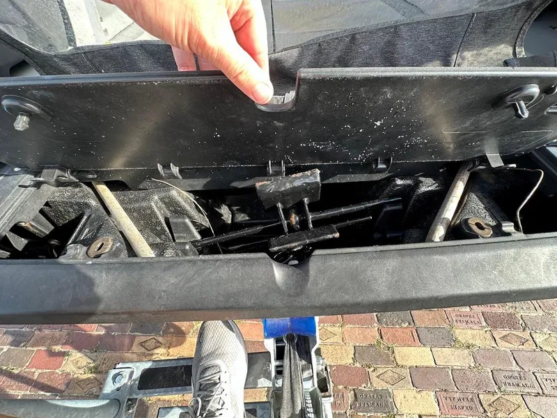 Slide: The Image of 2023 Sea-Doo Switch Cruise 21 storage compartment detail with hand opening lid. - 21