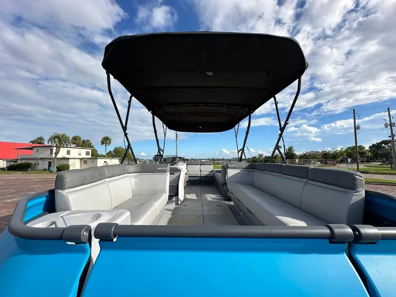 Slide: The Image of 2023 Sea-Doo Switch Cruise 21 pontoon boat with spacious seating and canopy. - 22