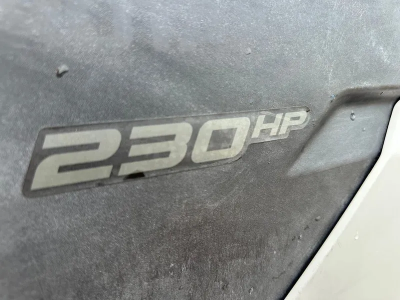 Slide: The Image of Close-up of 230 HP badge on 2023 Sea-Doo Switch Cruise 21. - 25