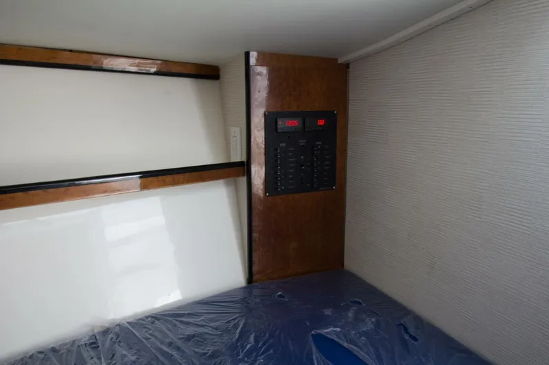 Slide: The Image of Interior of 1997 Lazzara Aura Tournament boat with control panel and wooden accents. - 14