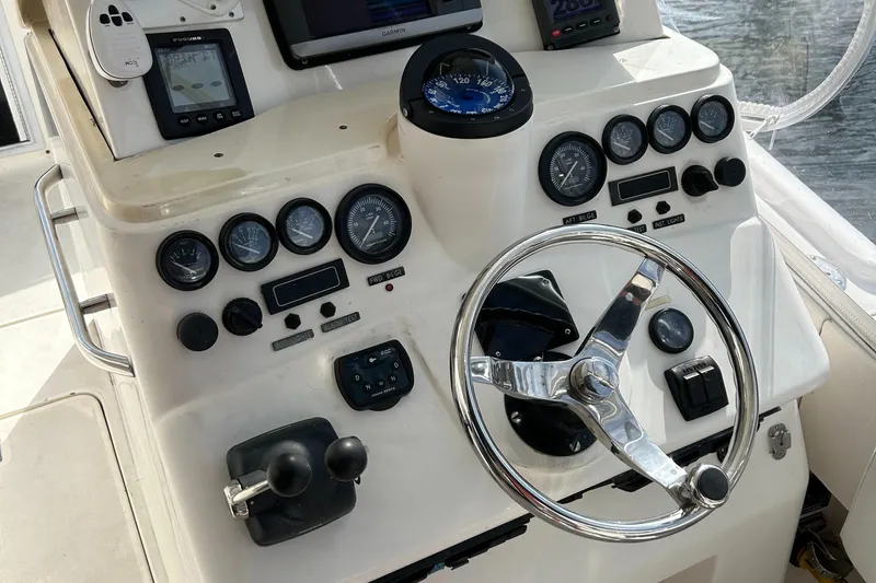 Slide: The Image of Control panel of 1997 Lazzara Aura Tournament boat with steering wheel and gauges. - 7
