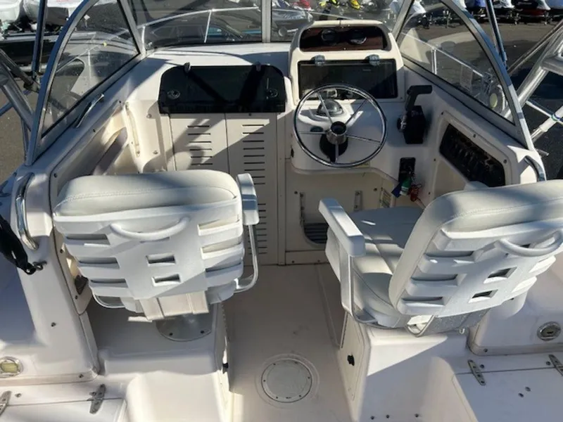 Slide: The Image of 2000 Grady-White 202 Adventure boat interior with dual seats and steering console. - 15