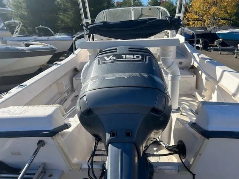 Slide: The Image of 2000 Grady-White 202 Adventure boat with V6 150 engine, docked outdoors. - 5