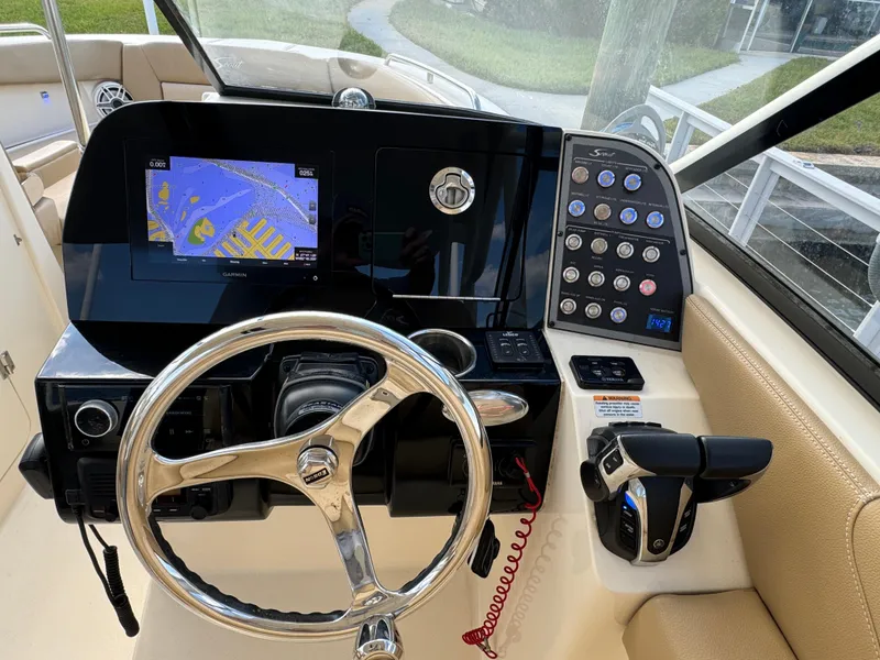 Slide: The Image of 2021 Scout 255 Dorado boat on calm water, featuring Yamaha outboard motor. - 11