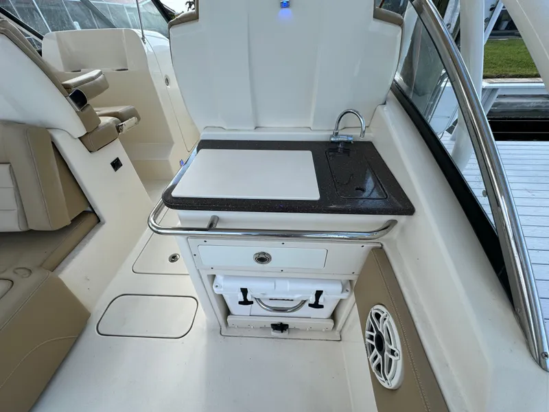 Slide: The Image of 2021 Scout 255 Dorado boat docked at marina on a sunny day. - 15