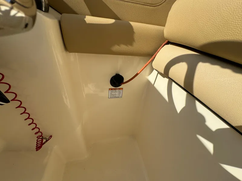 Slide: The Image of 2021 Scout 255 Dorado boat dashboard with steering wheel and navigation system. - 23