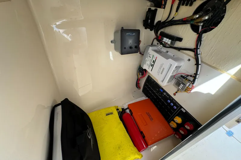 Slide: The Image of 2021 Scout 255 Dorado boat interior with seating, docked by the water. - 25