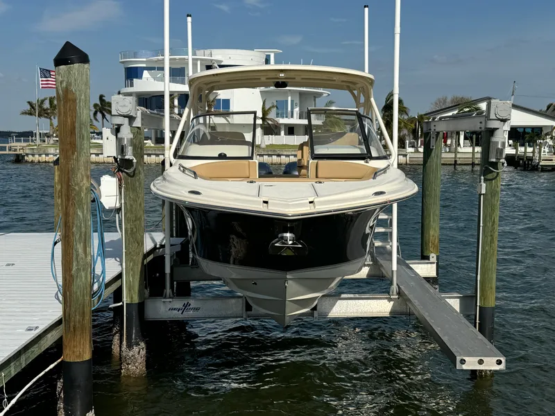 Slide: The Image of 2021 Scout 255 Dorado boat with dual engines on calm water. - 4