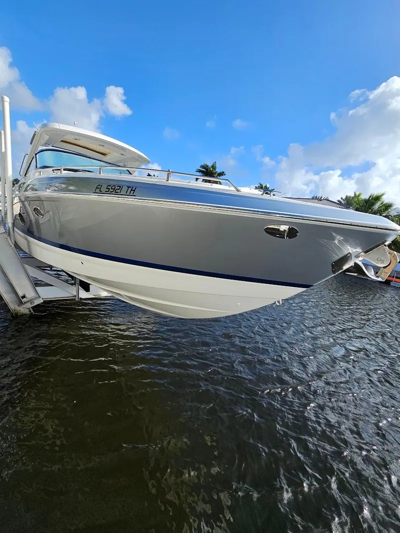 Slide: The Image of 2023 Formula 350 Crossover Bowrider on water, sleek design, blue sky background. - 12