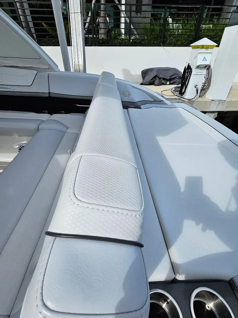 Slide: The Image of 2023 Formula 350 Crossover Bowrider, sleek white seating and deck detail. - 19