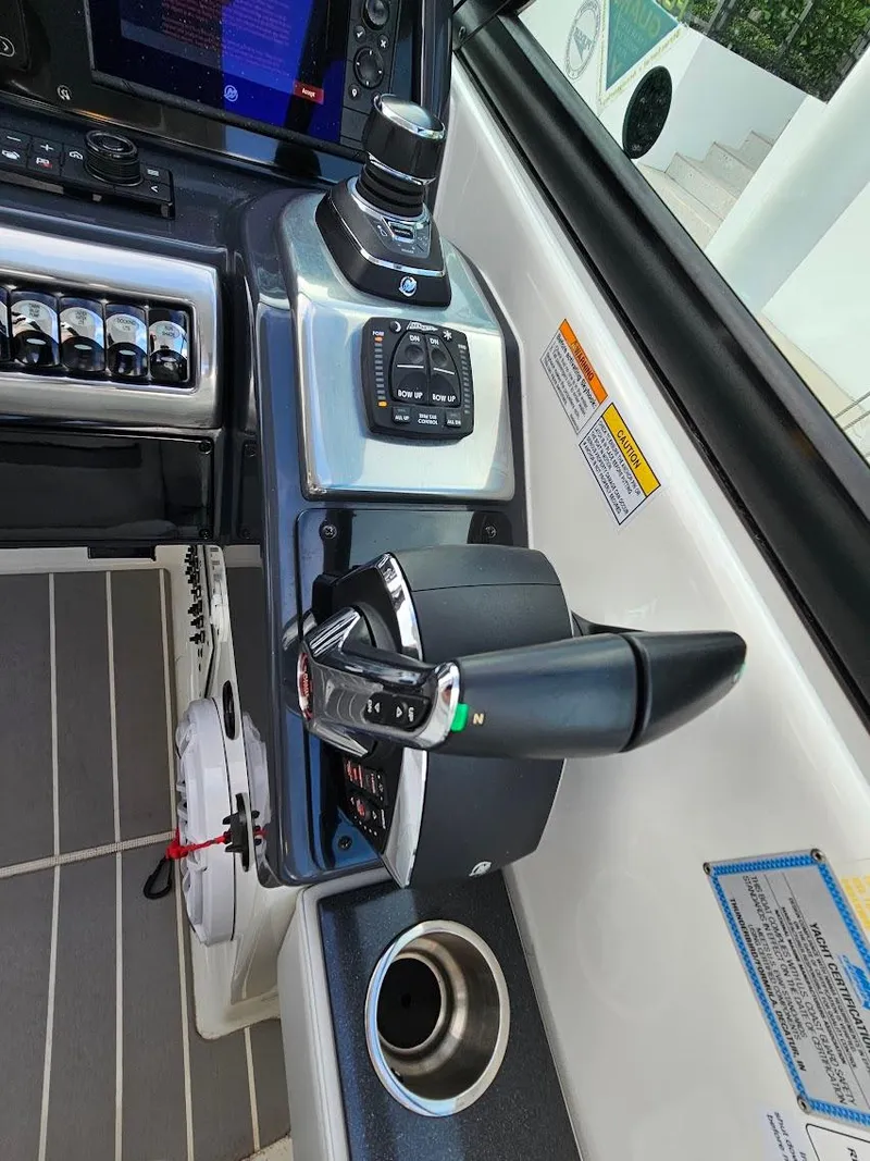 Slide: The Image of 2023 Formula 350 Crossover Bowrider cockpit with modern controls and navigation system. - 24