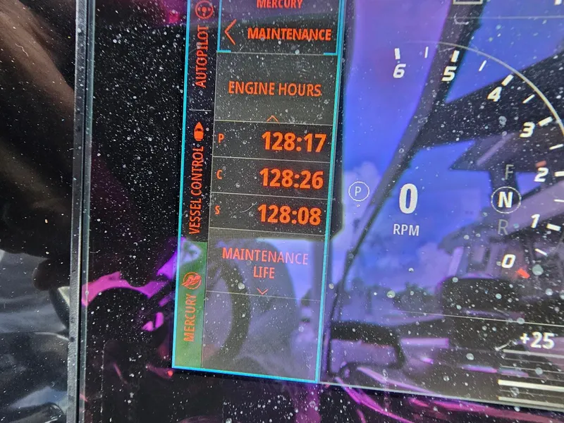 Slide: The Image of Dashboard display of 2023 Formula 350 Crossover Bowrider showing engine hours and maintenance info. - 26