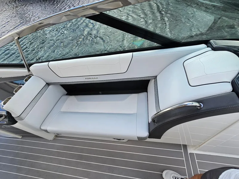 Slide: The Image of 2023 Formula 350 Crossover Bowrider interior with sleek white seating and modern design. - 27