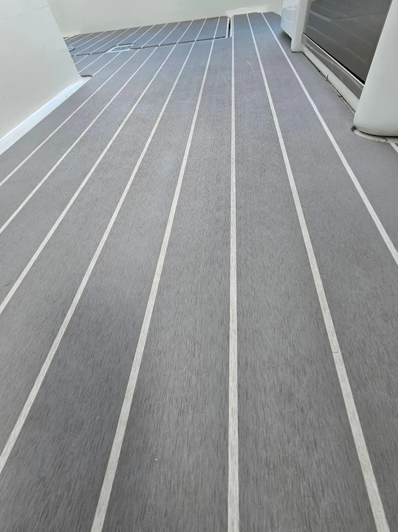 Slide: The Image of 2023 Formula 350 Crossover Bowrider deck with sleek, modern flooring design. - 30